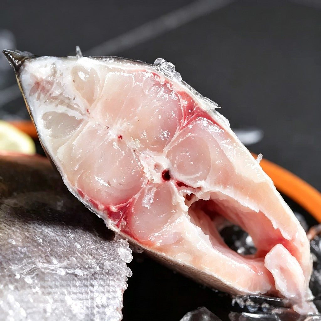 Raw red pomfret on crushed ice showing red fins
